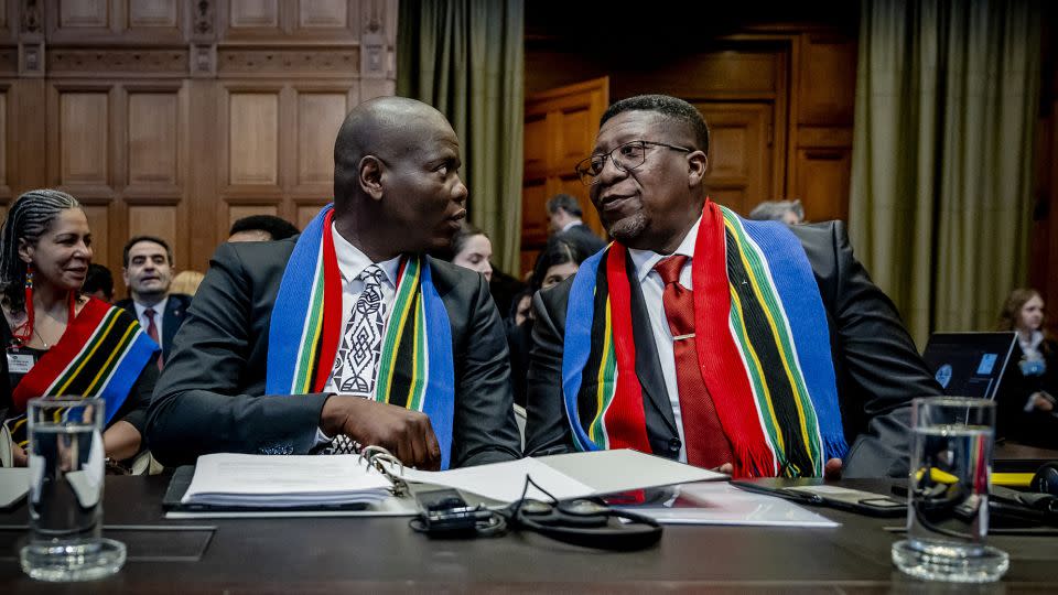South African Justice Minister Ronald Lamola, left, and Ambassador to the Netherlands Vusimuzi Madonsela, right, spoke at Thursday's hearing. - Remko de Waal/AFP/Getty Images