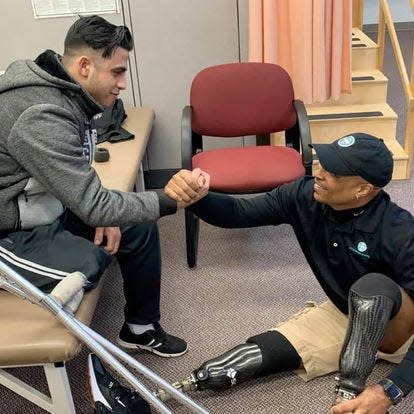 Mohammad Al Ajouri with College Park Industries patient advocate and fellow amputee Reggie Showers.