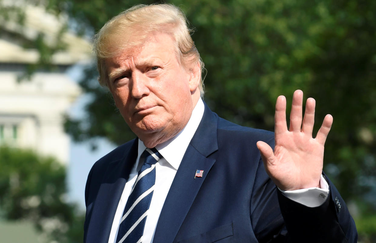 U.S. President Donald Trump waves to the press as he returns to the White House, Washington, U.S., after a weekend at his golf club in Bedminster, New Jersey, July 21, 2019.            REUTERS/Mike Theiler