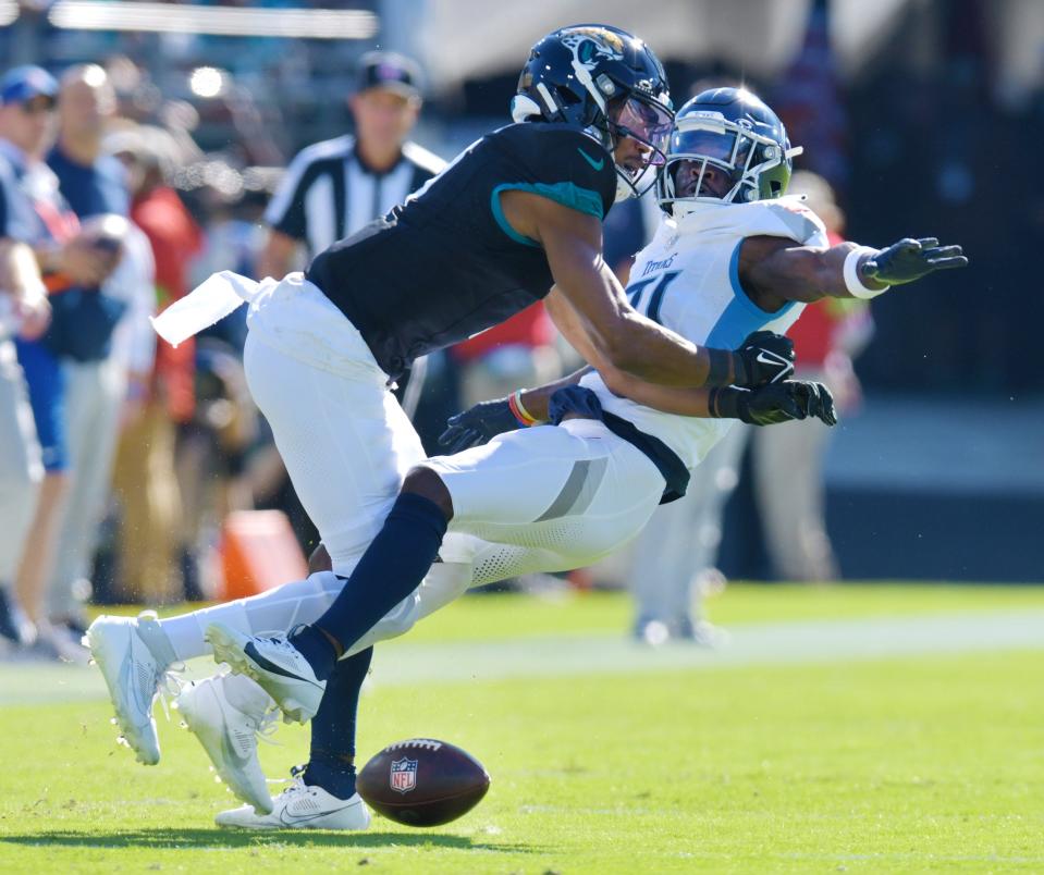 Titans linebacker Otis Reese IV (41) breaks up a pass intended for Jaguars wide receiver Zay Jones (7) on Nov. 19. Reese was penalized for pass interference on the play.