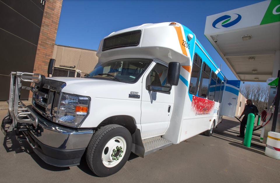 Keith Zachary, a maintenance supervisor for the Stark Area Regional Transit Authority, pumps compressed natural gas into a SARTA ProLine paratransit vehicle, at SARTA's Canton headquarters on Monday. SARTA is part of a cooperative effort with other transit agencies to fund the development of a software platform that would allow SARTA and those agencies to provide out-of-county paratransit trips for people with disabilities by 2026.