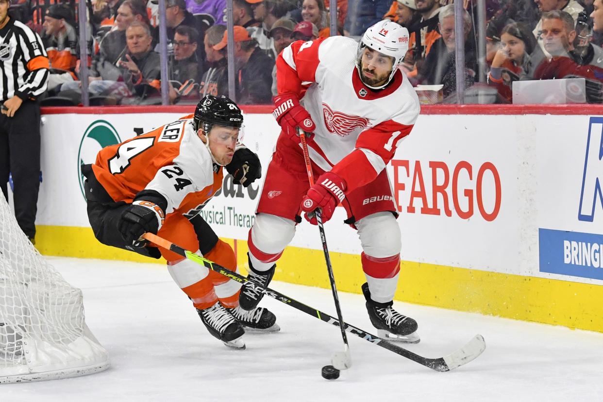 Red Wings center Robby Fabbri and Flyers defenseman Nick Seeler battle for the puck during the second period of the Wins' 1-0 loss on Saturday, Dec. 16, 2023, in Philadelphia.