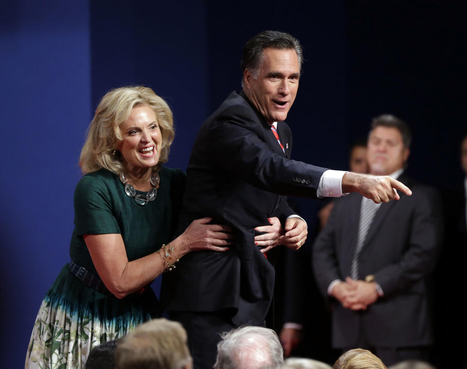 Ann Romney, wife of Republican presidential candidate, former Massachusetts Gov. Mitt Romney, laughs as she pulls her husband away from the edge of the stage after the third presidential debate with President Barack Obama at Lynn University, Monday, Oct. 22, 2012, in Boca Raton, Fla. (AP Photo/Pablo Martinez Monsivais)