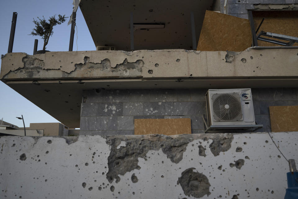 A damaged building, from previous shelling attacks from Lebanon, is seen in Kiryat Shmona, northern Israel, Wednesday, June 19, 2024. Hezbollah began attacking Israel almost immediately after the Israel-Hamas war erupted on Oct. 7. There have been near daily exchanges of fire, though most of the strikes are confined to an area within a few mostly confined to the area around the border. (AP Photo/Leo Correa)