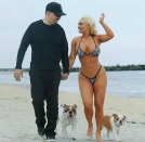 <p>Also in the longtime love club are Coco Austin and Ice-T, who just celebrated 17 years together! To mark the occasion, Coco shared a pic of her and her beloved strolling down the beach (with Austin in a teeny bikini, of course) along with their beloved dogs. “17 years still going strong,” Austin wrote. “Happy Anniversary to the love of my life. You made me a happy wife. For always and forever!” She also added, “We got some crazy outfits.. Hehe.” In case you weren’t clear on that. (Photo: <a rel="nofollow noopener" href="https://www.instagram.com/p/BdYty-6FoMK/?hl=en&taken-by=coco" target="_blank" data-ylk="slk:Coco Austin via Instagram;elm:context_link;itc:0;sec:content-canvas" class="link ">Coco Austin via Instagram</a>) </p>