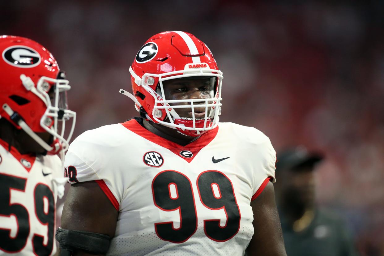 Dec 4, 2021; Atlanta, GA, USA; Georgia Bulldogs defensive lineman Jordan Davis (99) runs drills before the SEC championship game against Alabama Crimson Tide at Mercedes-Benz Stadium. Brett Davis-USA TODAY Sports