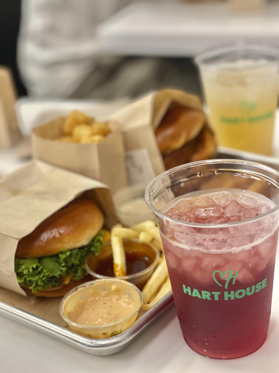 A double burg’r, crispy tots, crispy chick’n nuggets, french fries, Hart House signature dippin sauces, as well as berry patch and limeade drinks are pictured on Thursday, Aug. 25, 2022, in Los Angeles.  Kevin Hart opened his first plant-based, fast-food restaurant called Hart House on Thursday in the Westchester neighborhood of Los Angeles near the city’s airport. He wants this new venture to attract regular plant-base eaters along with those who haven’t yet been introduced to that world of healthy eating.  (AP Photo/Jonathan Landrum Jr.)