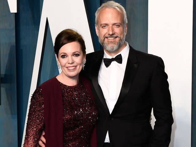 <p>PATRICK T. FALLON/AFP/Getty</p> Olivia Colman and husband Ed Sinclair attend the 2022 Vanity Fair Oscar Party following the 94th Oscars on March 27, 2022.