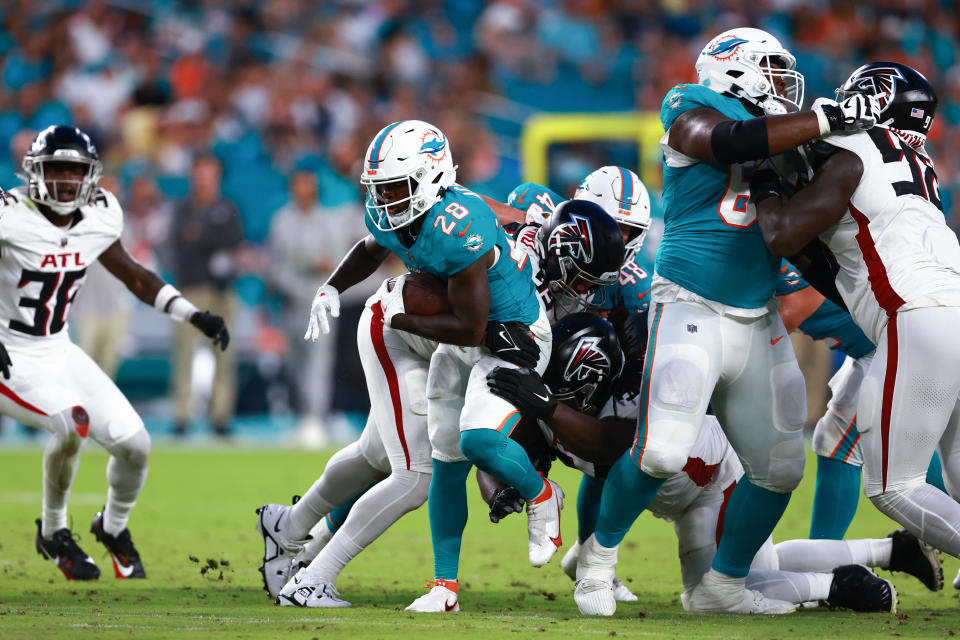 MIAMI GARDENS, FLORIDA - AUGUST 11: De'Von Achane #28 of the Miami Dolphins carries the ball against the Atlanta Falcons during the second quarter during a preseason game at Hard Rock Stadium on August 11, 2023 in Miami Gardens, Florida. (Photo by Megan Briggs/Getty Images)