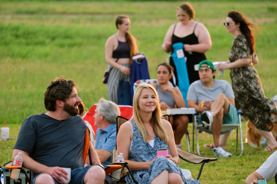 People attend an outdoor screening of "We Are the Thousand" in the Wheeler District as part of the 2021 deadCenter Film Festival.