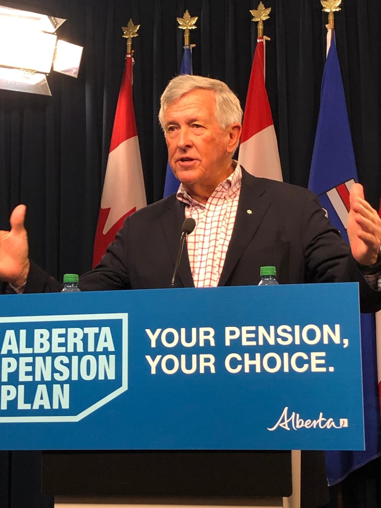 Jim Dinning, chair of Alberta's pension engagement panel, gestures during a news conference in Edmonton on Friday.  (Michelle Bellefontaine/CBC - image credit)