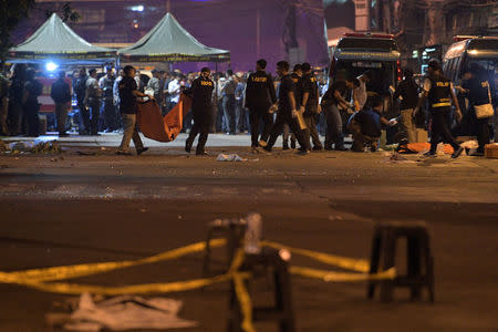 Police investigate the scene of an explosion at a bus station in Kampung Melayu, East Jakarta, Indonesia. Antara Foto/Sigid Kurniawan/ via REUTERS