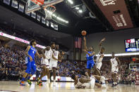 Kentucky guard Immanuel Quickley (5) shoots over fallen Texas A&M guard Wendell Mitchell (11) during the first half of an NCAA college basketball game Tuesday, Feb. 25, 2020, in College Station, Texas. (AP Photo/Sam Craft)