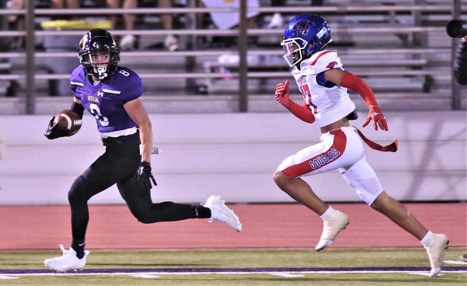 Wylie's Braden Regala runs for a 54-yard TD pass as Cooper's Zavian Alexander gives chase. The score was wiped out by a penalty with 8:20 left in the third quarter. Wylie beat the Coogs 20-10 in the District 2-5A Division II game Nov. 4 at Sandifer Stadium.