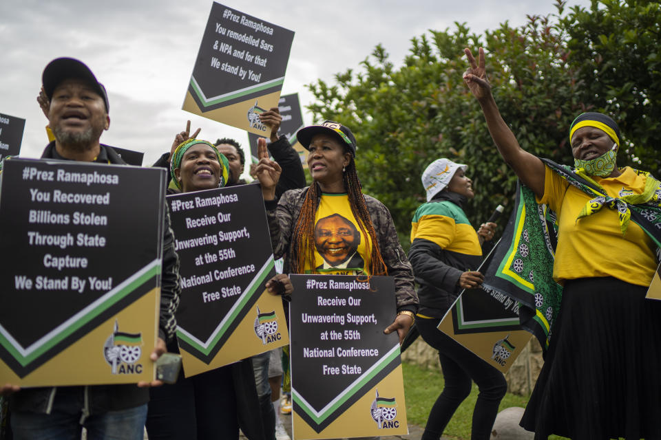 Supporters of South African President Cyril Ramaphosa picket outside a meeting of the African National Congress (ANC) national executive committee in Johannesburg, South Africa, Monday Dec. 5, 2022. Ramaphosa might lose his job, and his reputation as a corruption fighter, as he faces possible impeachment over claims that he tried to cover up the theft of millions of dollars stashed inside a couch on his farm. (AP Photo/Jerome Delay)