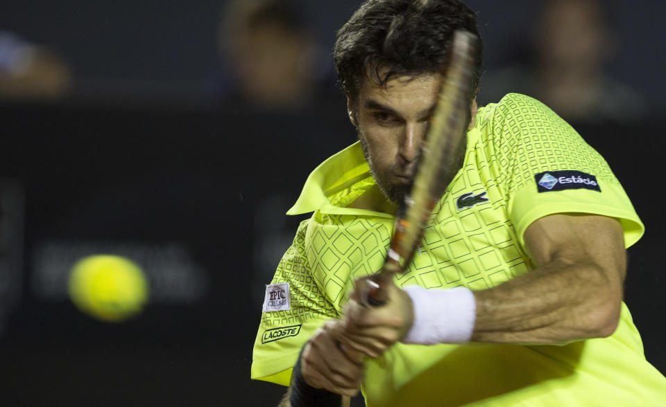 Pablo Andujar of Spain, returns the ball to Rafael Nadal, of Spain, during a semifinal match at the Rio Open tennis tournament in Rio de Janeiro, Brazil, Saturday, Feb. 22, 2014. (AP Photo/Leo Correa)