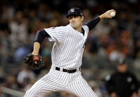 Oct 6, 2015; Bronx, NY, USA; New York Yankees relief pitcher Andrew Miller (48) throws against the Houston Astros during the eighth inning in the American League Wild Card playoff baseball game at Yankee Stadium. Adam Hunger-USA TODAY Sports