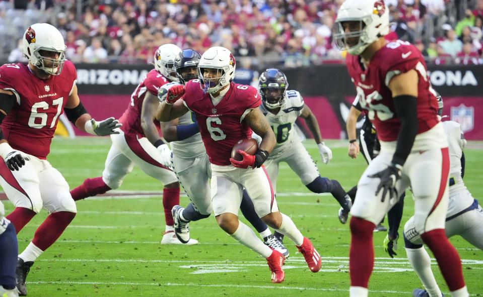 Jan 9, 2022; Glendale, Arizona, USA; Arizona Cardinals running back James Conner (6) runs the ball against the Seattle Seahawks in the first half at State Farm Stadium. Mandatory Credit: Rob Schumacher-Arizona Republic