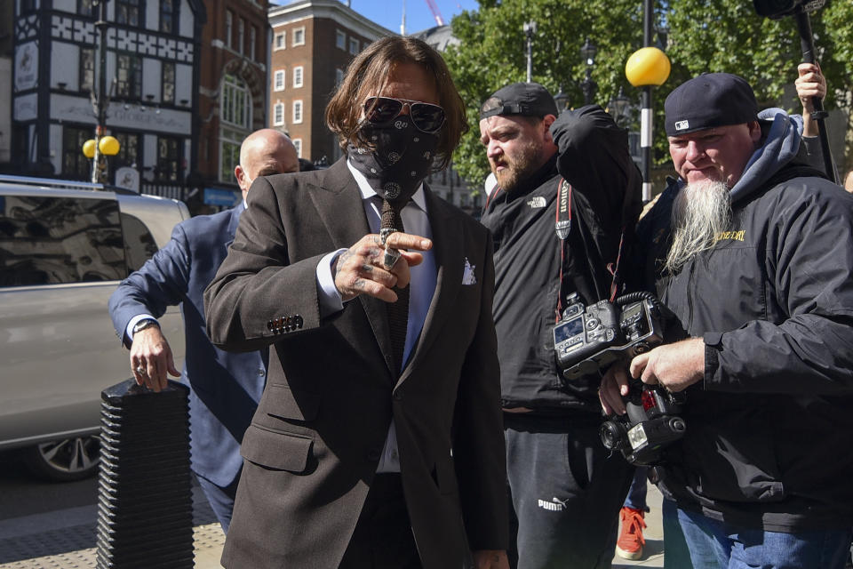 Johnny Depp arrives at the High Court in London, Friday July 10, 2020. Depp is back in the witness box at the trial of his libel suit against a tabloid newspaper that called him a "wife-beater" in an April 2018 article that said he'd physically abused ex-wife Amber Heard. Depp strongly denies the allegations.(AP Photo/Alberto Pezzali)