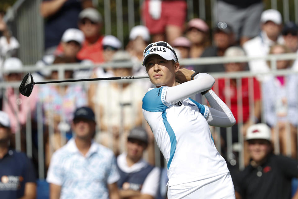 Nelly Korda watches her shot on the first tee during the first round of the PNC Championship golf tournament Saturday, Dec. 18, 2021, in Orlando, Fla. (AP Photo/Scott Audette)