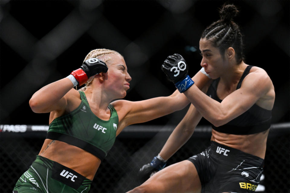 Jul 22, 2023; London, UNITED KINGDOM; Shauna Bannon (red gloves) fights Bruna Brasil (blue gloves) during UFC Fight Night at O2 Arena. Mandatory Credit: Per Haljestam-USA TODAY Sports