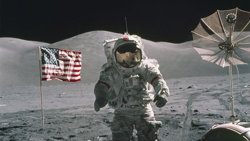 An Apollo 17 astronaut stands on the moon’s surface in 1972 with the United States flag in the background. Apollo 17 was the seventh and last manned lunar landing and return-to-Earth mission.