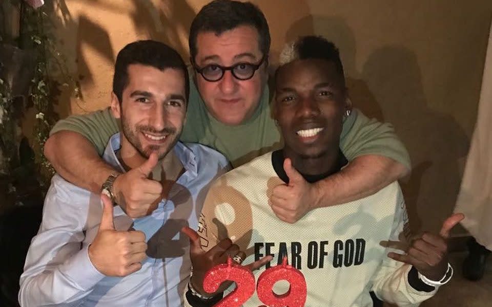 Mino Raiola puts his arms around Paul Pogba and Henrikh Mkhitaryan  - INSTAGRAM