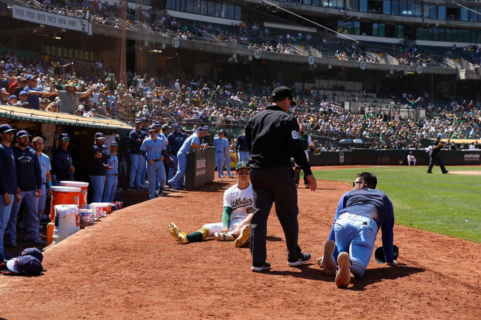 OAKLAND, CALIFORNIA - JUNE 09: First baseman Tyler Soderstrom #21 of the Oakland Athletics looks on after colliding with Yusei Kikuchi #16 of the Toronto Blue Jays in foul territory in the top of the tenth inning at Oakland Coliseum on June 09, 2024 in Oakland, California. (Photo by Lachlan Cunningham/Getty Images)