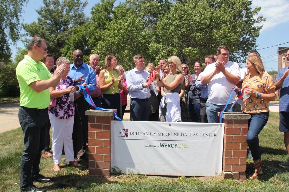 Attendees react as the ribbon is cut at DCH Family Medicine Dallas Center on Friday, July 28, 2023.