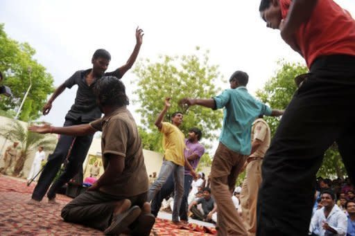 Inmates dance in front of other prisoners to live music during a small concert at the Tihar jail in New Delhi. Tihar jail has a record of innovative rehabilitation schemes for prisoners including yoga, meditation, art classes and a shop selling products made by inmates