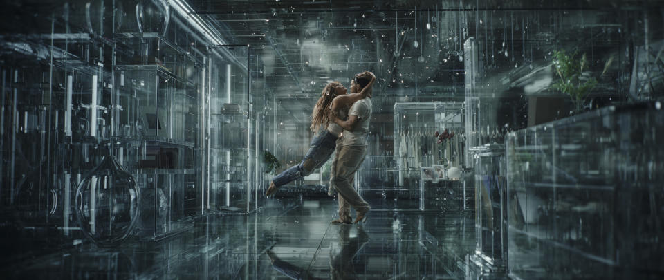 a woman jumps into a man's arms in a snowy cgi landscape