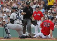 Jul 16, 2017; Boston, MA, USA; Boston Red Sox first baseman Sam Travis (59) tagged out at home plate by New York Yankees catcher Austin Romine (27) in the second inning at Fenway Park. Mandatory Credit: David Butler II-USA TODAY Sports