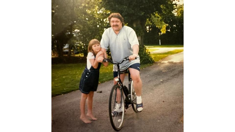father on bike with daughter