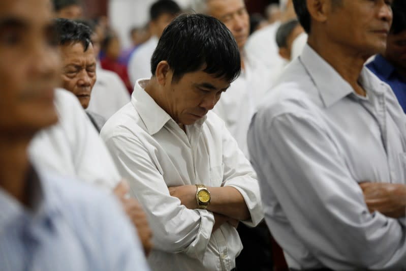 Catholics attend a mass prayer for 39 people found dead in the back of a truck near London, UK at My Khanh parish in Nghe An province