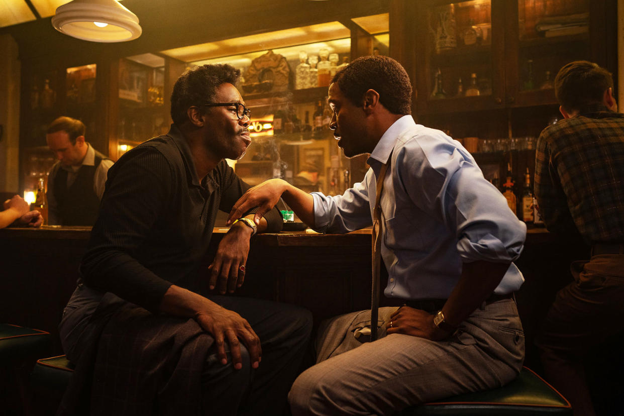 Colman Domingo as Bayard Rustin and Johnny Ramey as Elias sit a bar during a scene in 