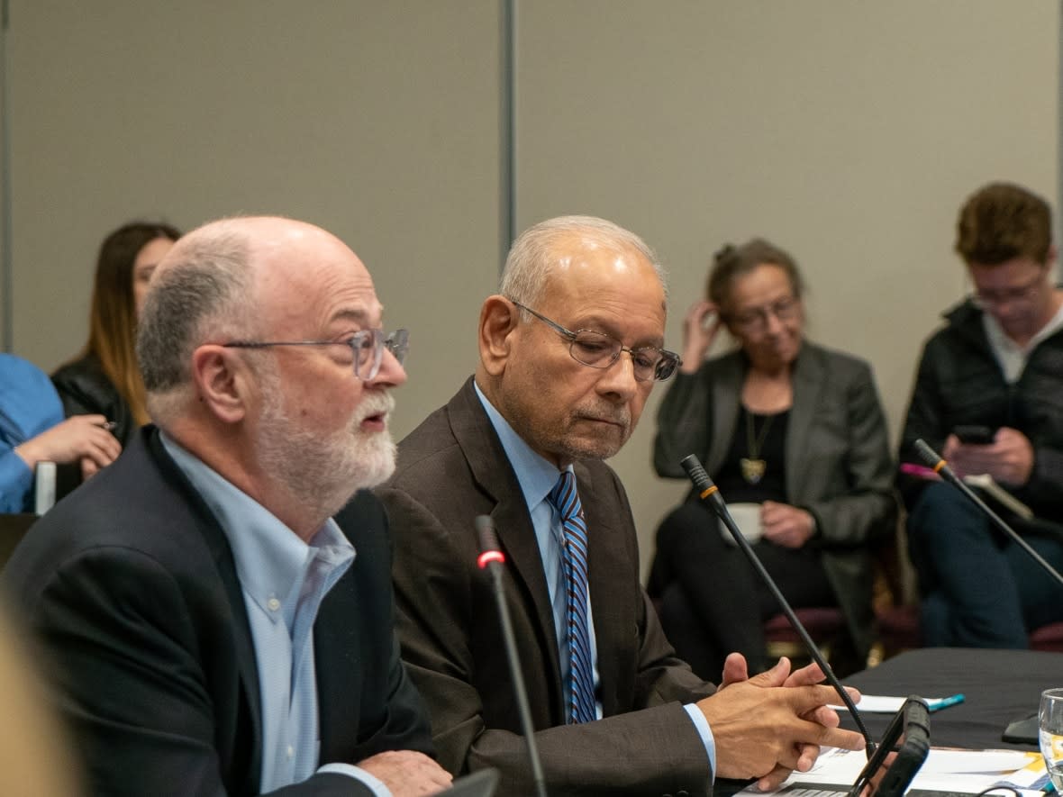 Malcome Mercer, left, and Alok Mukherjee speak during a special Thunder Bay Police Service oversight board meeting in the northwestern Ontario city in April 2023. Mercer's term as board administrator has ended, with his report issued Friday by the Ontario Civilian Police Commission. (Marc Doucette/CBC - image credit)