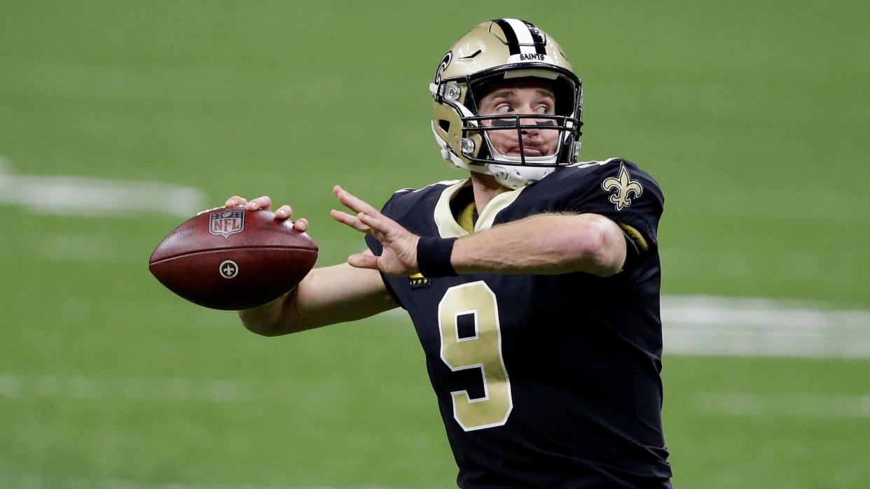 Mandatory Credit: Photo by Butch Dill/AP/Shutterstock (11713998m)New Orleans Saints quarterback Drew Brees (9) warms up before the first half of an NFL divisional round playoff football game against the Tampa Bay Buccaneers, in New OrleansBuccaneers Saints Football, New Orleans, United States - 17 Jan 2021.