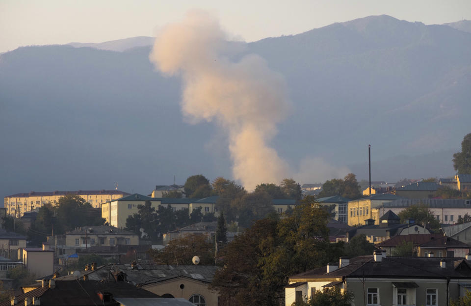 Smoke rises after shelling by Azerbaijan's artillery during a military conflict, in Stepanakert, the separatist region of Nagorno-Karabakh, Thursday, Oct. 29, 2020. Fighting over the separatist territory of Nagorno-Karabakh continued on Thursday, as the latest cease-fire agreement brokered by the U.S. failed to halt the flare-up of a decades-old conflict between Armenia and Azerbaijan. (AP Photo)