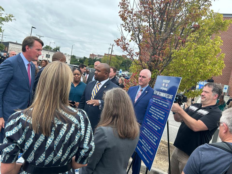 Gov. Glenn Youngkin greets representatives of the public-safety 'pillar' of the Partnership for Petersburg Wednesday, Sept. 27, 2023, in the parking lot of the Petersburg Public Library. The library hosted a one-year anniversary celebration of the partnership.