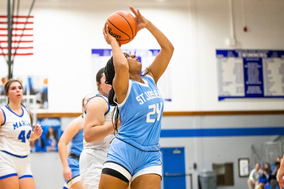 Saint Joseph's Kayla Woods (24) shoots during the Marian vs. Saint Joseph girls sectional championship basketball game Saturday, Feb. 4, 2023 at Marian High School.