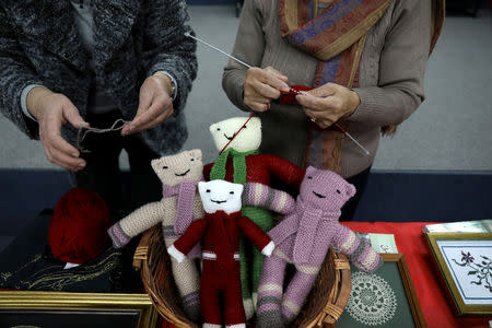 Women knit during a Christmas workshop to teach embroidery in the northern Israeli city of Nazareth, December 6, 2018. REUTERS/Ammar Awad