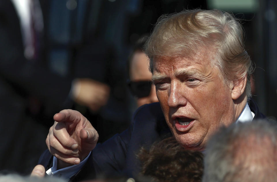 FILE - In this Friday Dec. 22, 2017, file photo President Donald Trump greets people on the tarmac as he arrives at Palm Beach International Airport, in West Palm Beach, Fla. Trump wants to countersue Summer Zervos, a former "Apprentice" contestant, who accused him of defaming her when he denied her sexual assault allegations. Trump lawyer Alina Habba asked a court’s permission Monday, Oct. 18, 2021, to pursue a counterclaim against Zervos. (AP Photo/Carolyn Kaster, File)