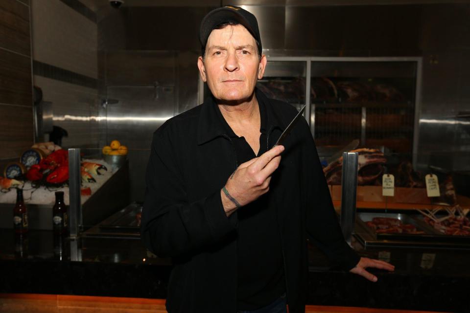 Charlie Sheen is presented with his personally engraved knife at NYY Steak inside Seminole Casino Coconut Creek in Coconut Creek Florida