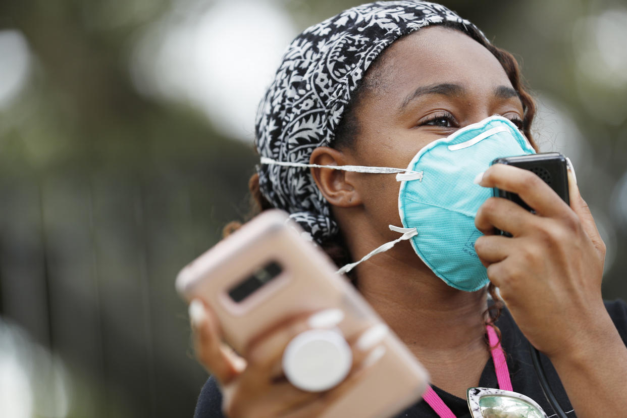 TAMPA, FL - JULY 02: Makyla Burks, a University of South Florida student wears a face mask while protesting in front of the Lifsey residence where the University of South Florida President Steven Currall lives on campus on July 2, 2020 in Tampa, Florida. Tampa Bay Students for Democratic Society protest at the University of South Florida demanding an increase in Black student enrollment, employ more Black faculty and staff, more financial aid, and make direct connections with the surrounding community. (Photo by Octavio Jones/Getty Images)