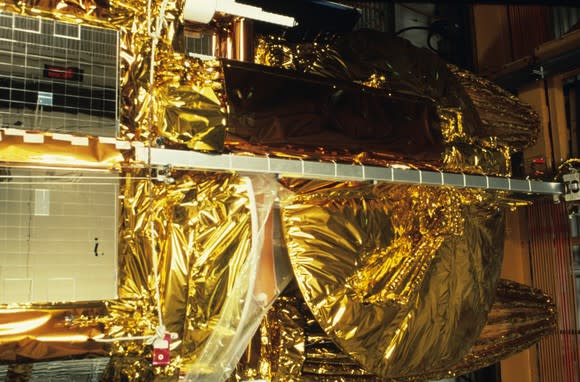 Foil-covered satellite under construction