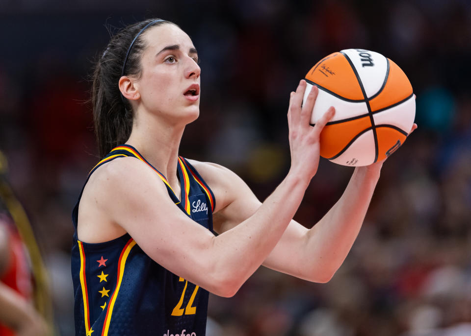 INDIANAPOLIS, INDIANA - JULY 10: Caitlin Clark #22 of the Indiana Fever shoots a free throw during the game against the Washington Mystics at Gainbridge Fieldhouse on July 10, 2024 in Indianapolis, Indiana. NOTE TO USER: User expressly acknowledges and agrees that, by downloading and or using this photograph, User is consenting to the terms and conditions of the Getty Images License Agreement. (Photo by Michael Hickey/Getty Images)