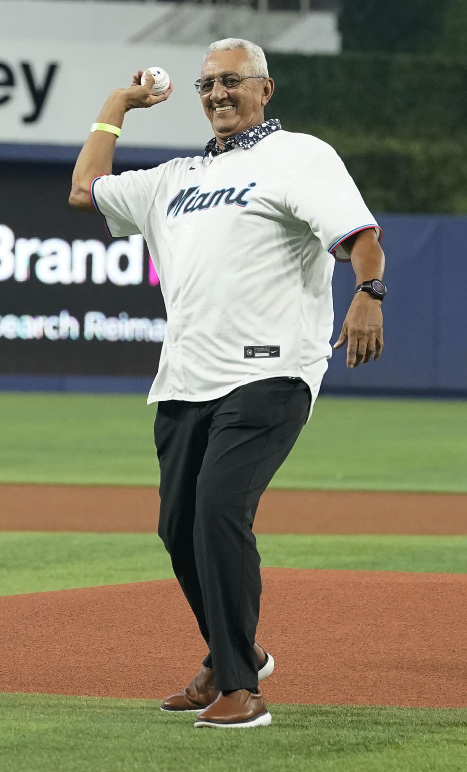 Former MLB player Dave Concepcion throws the ceremonial first pitch before a baseball game between the Miami Marlins and the Detroit Tigers, Saturday, July 29, 2023, in Miami. (AP Photo/Marta Lavandier)