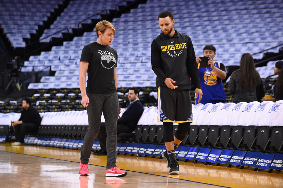 Steph Curry with trainer Chelsea Lane, who gets all credit for rehabbing Curry’s recent injuries. (Getty)