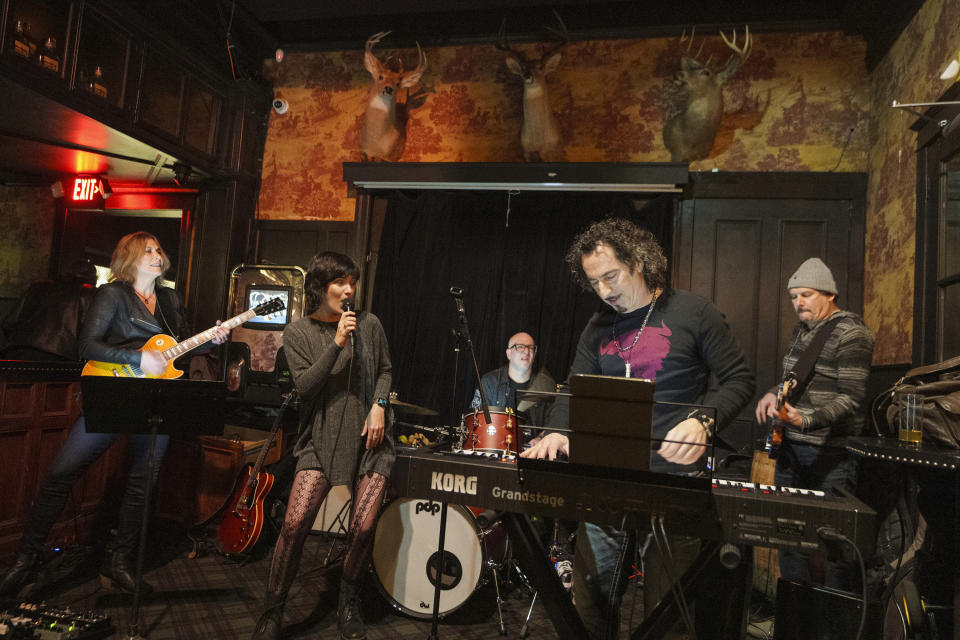 Sara Niemietz performs music of Superman with her group: Linda Taylor, drummer Léo Costa, Ed "Big Daddy" Roth, and Daniel Pearson at The Seven Grand, a whiskey bar downtown Los Angeles Tuesday, Feb. 28, 2023. (AP Photo/Damian Dovarganes)