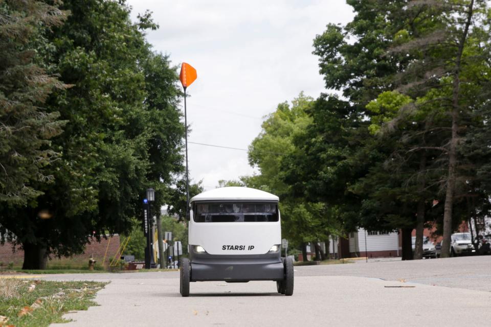 A Starship Technologies robot drives along the sidewalk on First st., Thursday, Aug. 8, 2019 in West Lafayette. The self-driving delivery robot is mapping the Purdue campus according to an employee.